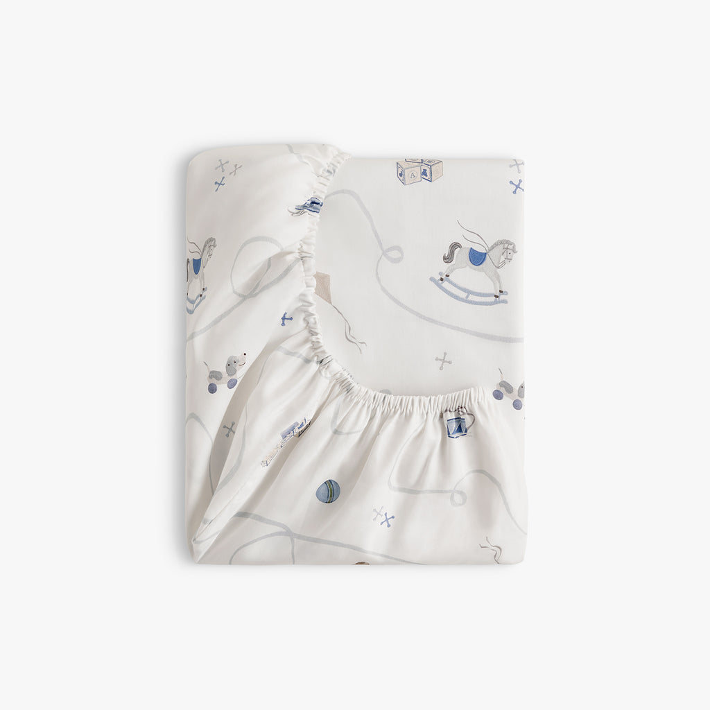 Baby changing pad cover with rocking horse pattern on a white background