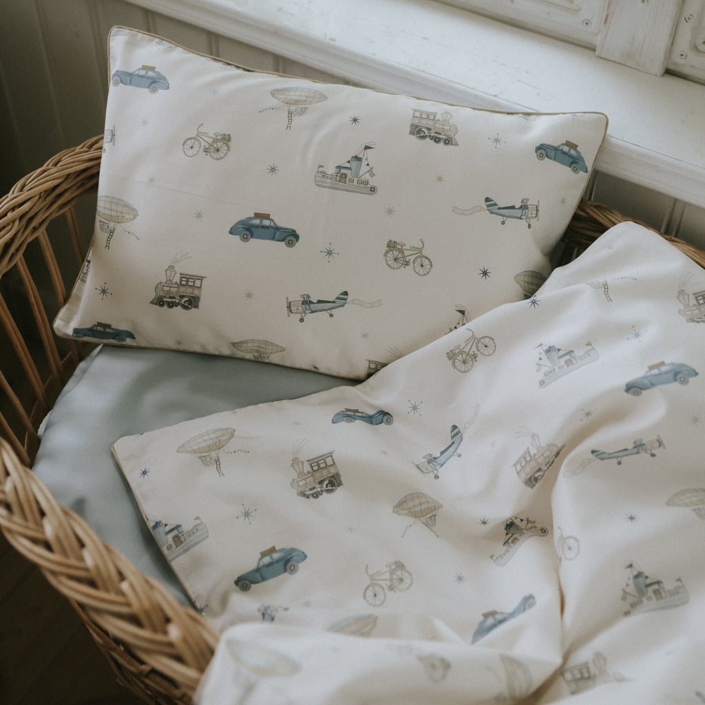 Transport Treasures Toddler Pillow in Blue in bassinet