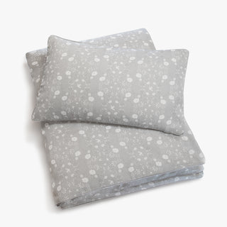 Toddler duvet in the "Bird's Song" print in the color grey, with the matching toddler pillow