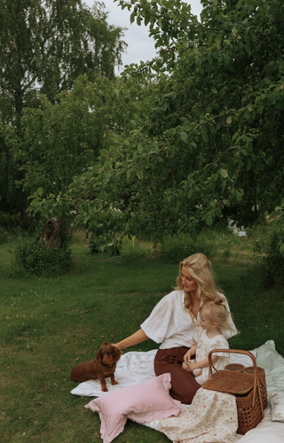 Mom with child in a garden 