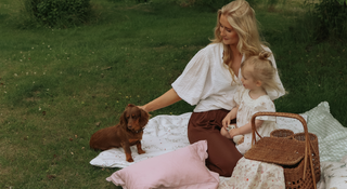 Mother with child on floor with the dog 