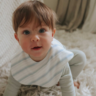 Winglet Bib in Seaside Stripes on baby