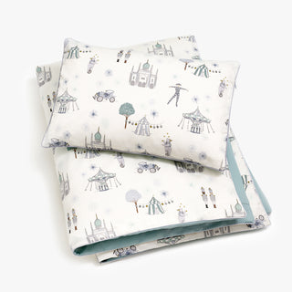 Toddler duvet in the "Adventures in Wonderland" print in the color aqua, with the matching toddler pillow