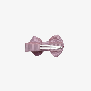 back of a pink bow showing the clip