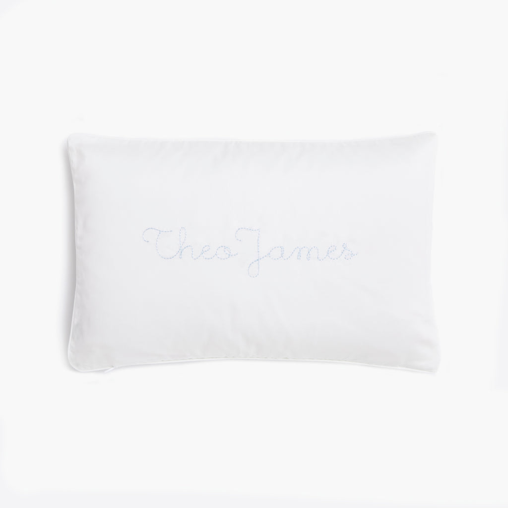 Toddler Pillow in Coastal Stripes in Blue  back side with the monogram "Theo James"