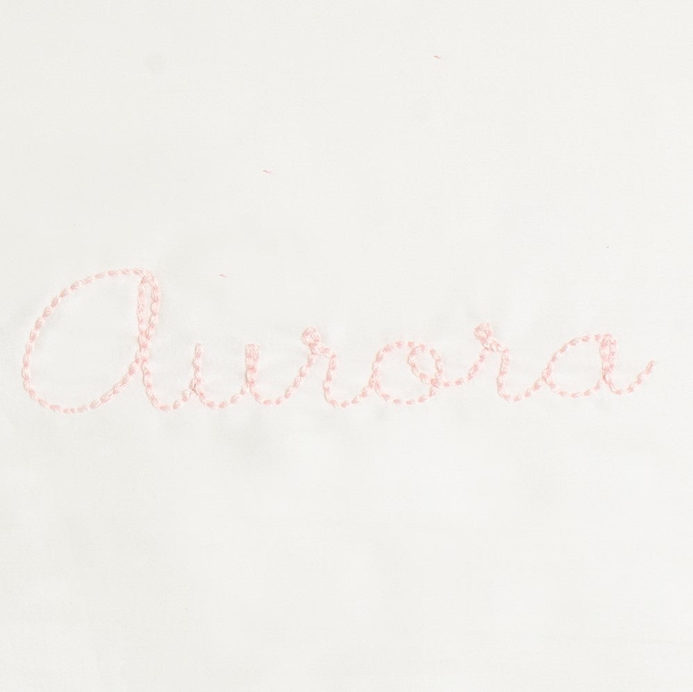 Monogram Detail in Pink Color way that says "Aurora"