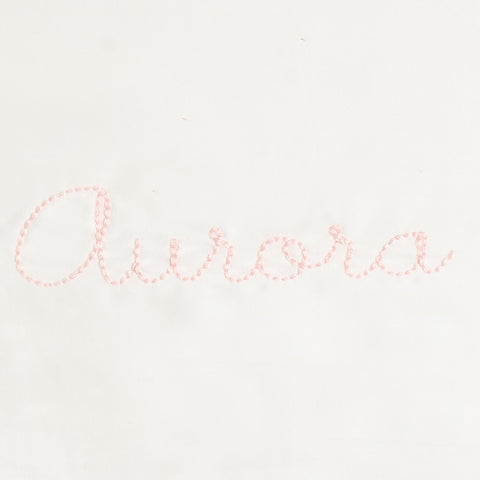 Monogram Detail in Pink Color way that says "Aurora"