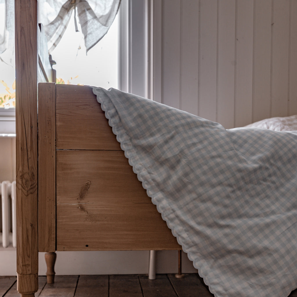 Toddler Bed and Picnic Blue GIngham Duvet Hanging On It