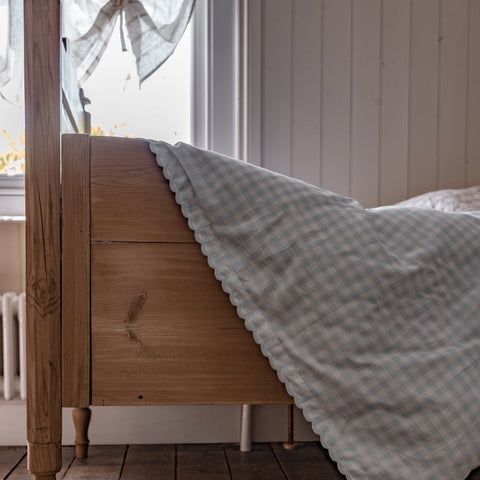 Toddler Bed and Picnic Blue GIngham Duvet Hanging On It