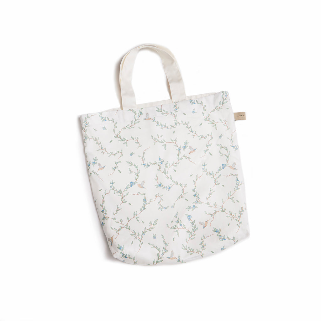 Tote Bag in Secret Garden print in Ivory . Tote bag is included with Play Mat.