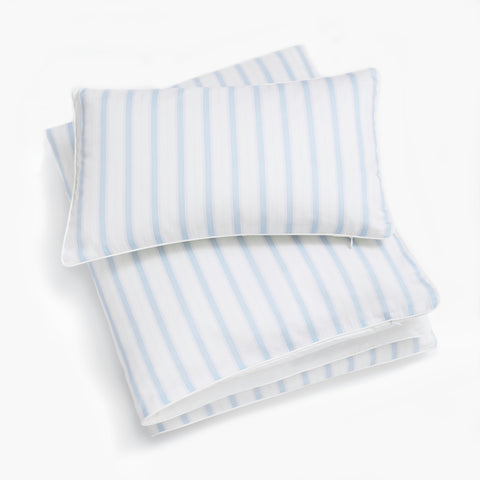 Toddler Pillow laying on top of Toddler Duvet In the Coastal Stripe Print 