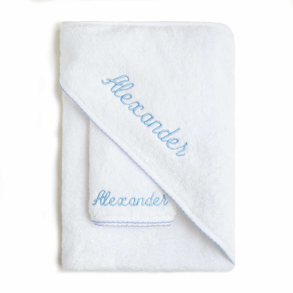Baby Hooded Towel with Blue Trim detail. Can be personalized with childs name. Towel is folded with washcloth.