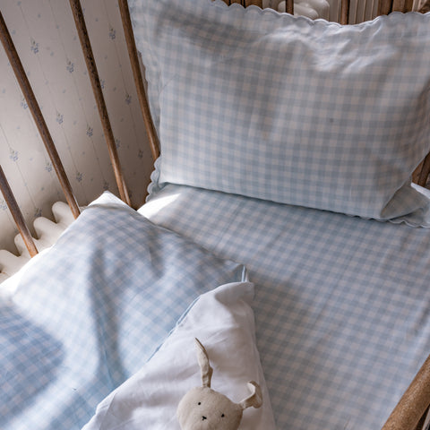 Toddler Duvet and Pillow in Blue Gingham in a Bed