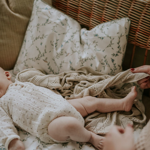 Baby playing with Mother, with the Secret Garden Standard Pillowcase Set in Ivory print in the background 