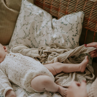 Baby playing with Mother, with the Secret Garden Standard Pillowcase Set in Ivory print in the background 