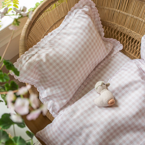 Toddler Pillow and baby Duvet in pink colorway of the gingham print with the gooselings toy on top