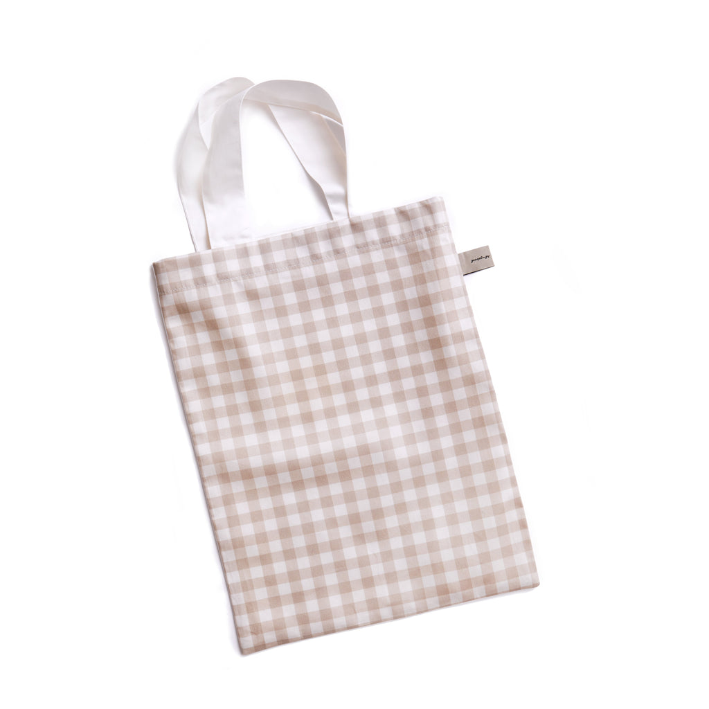 packaging of the bedding in the picnic gingham in beige