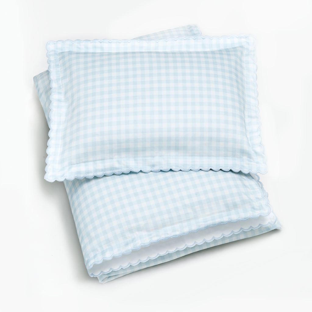Toddler duvet with pillow on top folded in the blue gingham print