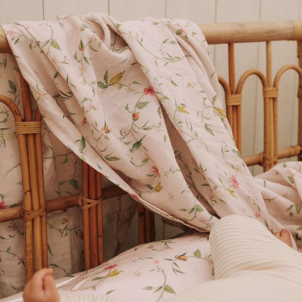 Dreaming of Paradise Swaddle hanging over crib
