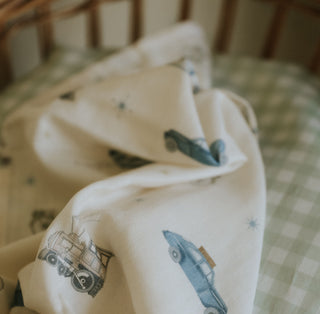 Swaddle in Transit Treasures laying in crib