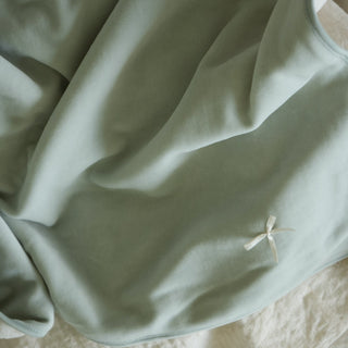 a close up shot of soft blanket in light blue