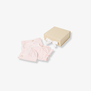 Pink baby outfit with matching hat on a white background