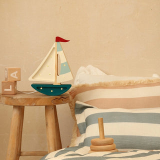 Little Lights Mini Sailboat Lamp on stool