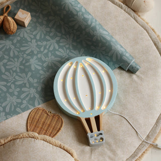 Little Lights Hot Air Balloon Lamp - Blue on a chair
