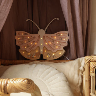 little light butterfly light on bed side
