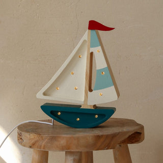 Little Lights Mini Sailboat Lamp on stool