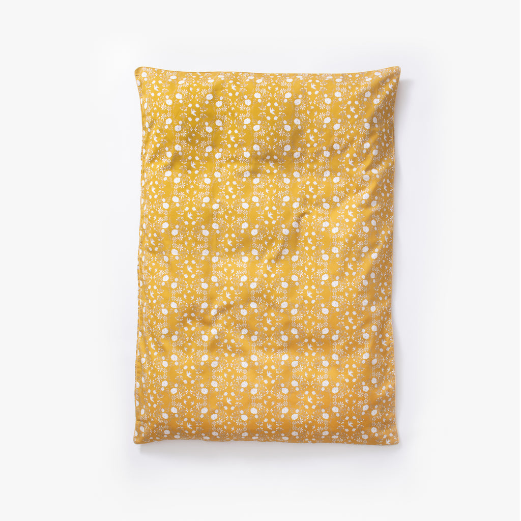 Baby duvet in the "Bird’s Song" print in the color mustard
