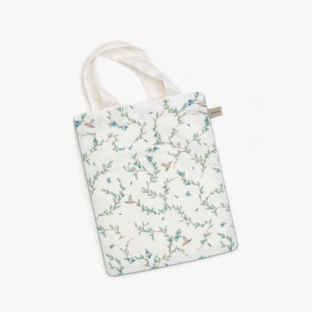 Printed tote bag is included with pillow in "Secret Garden" print in the color  vory