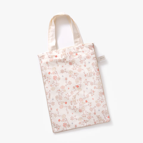 Printed tote bag is included with toddler duvet in "Into The Woodlands" print in the color ivory