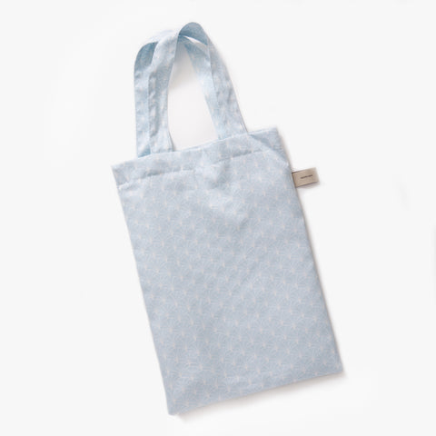 Printed tote bag is included with bedding in "Under The Arches" print in the color blue