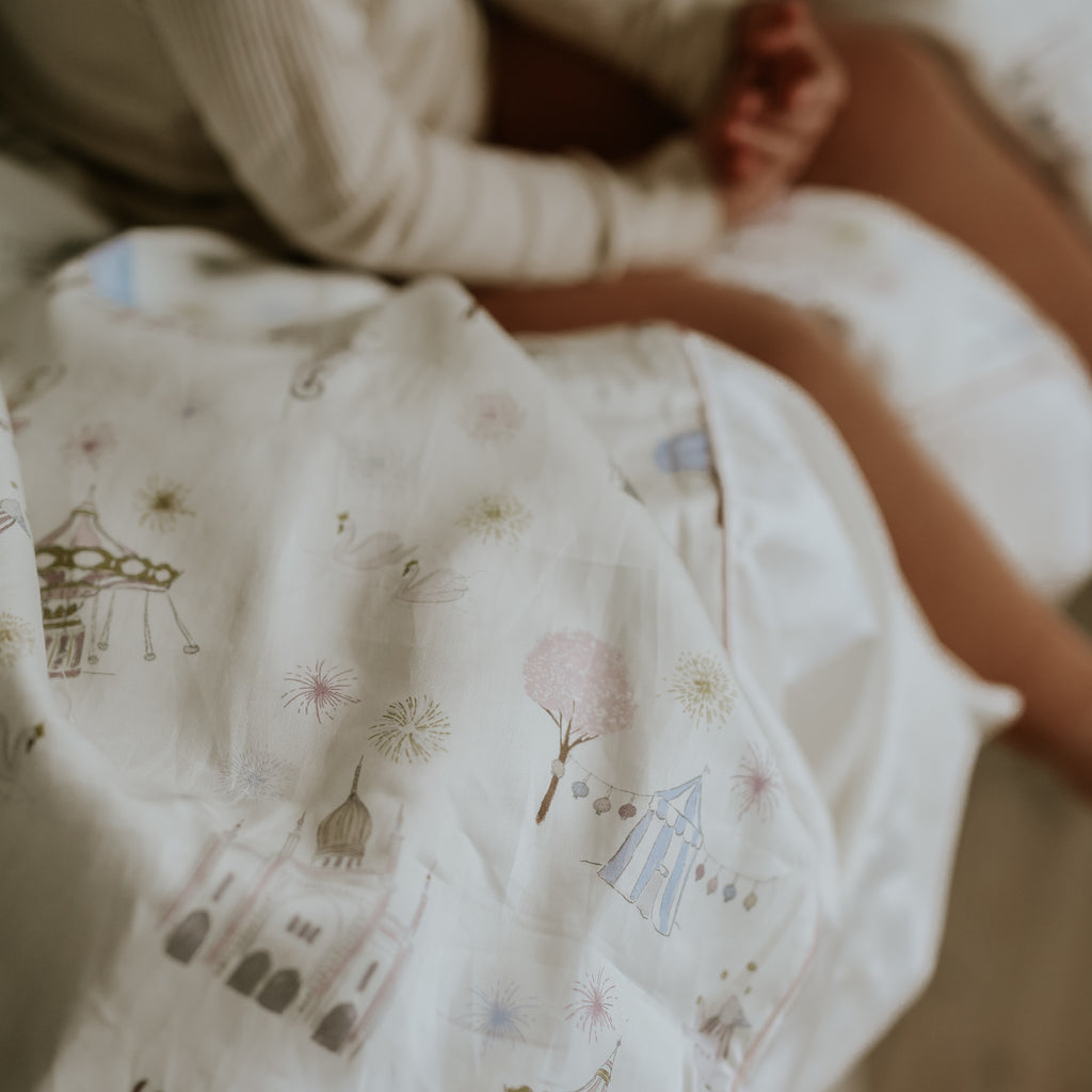 Toddler relaxing with the Gooselings duvet