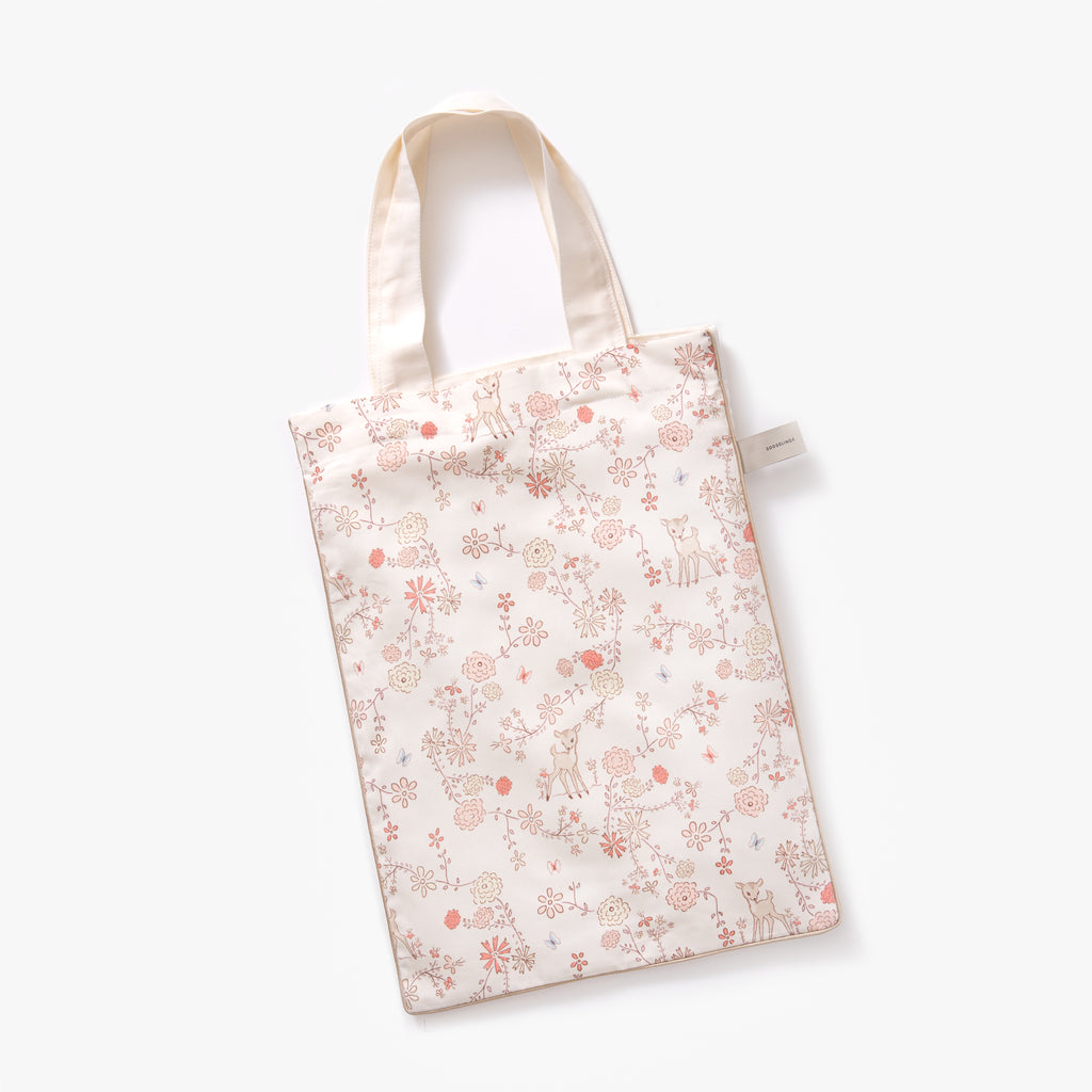 Printed tote bag is included with pillow in "Into The Woodlands" print in the color ivory
