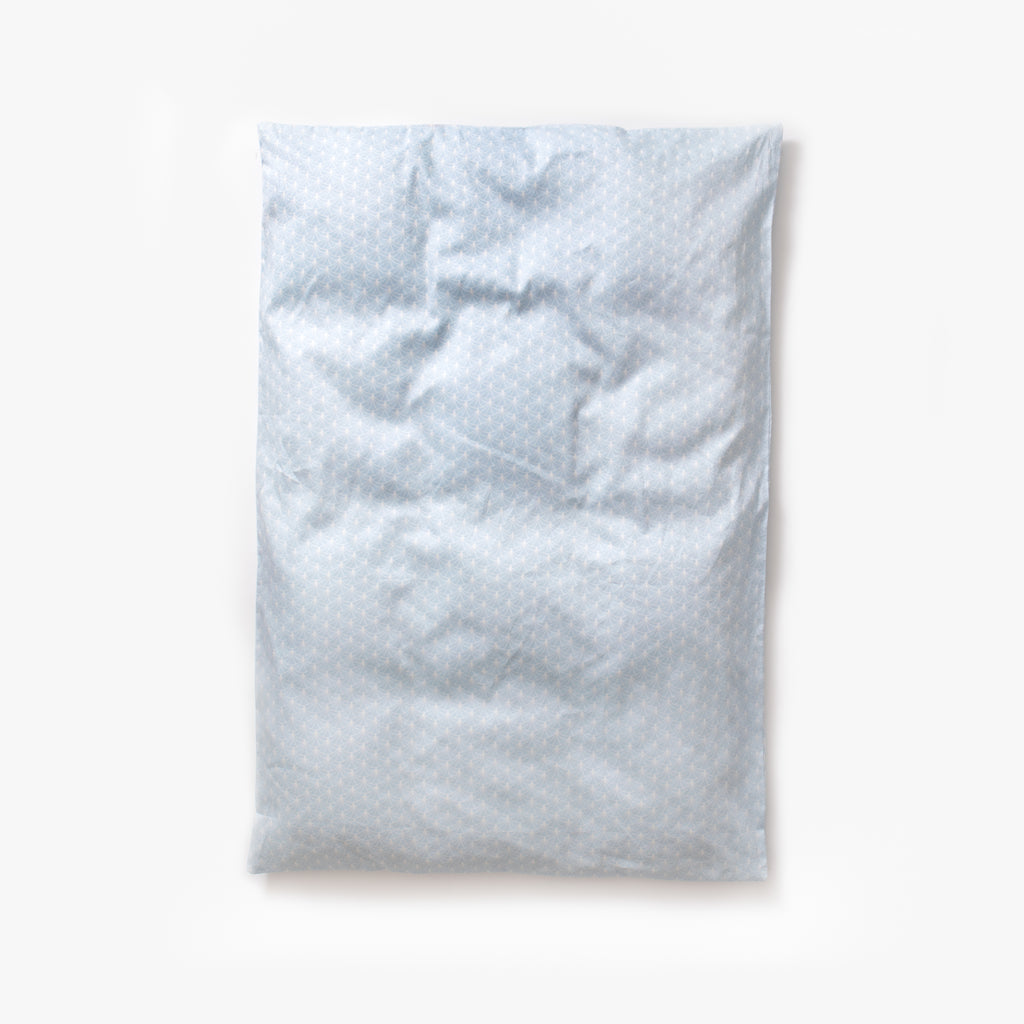 Baby duvet in the "Under The Arches" print in the color blue