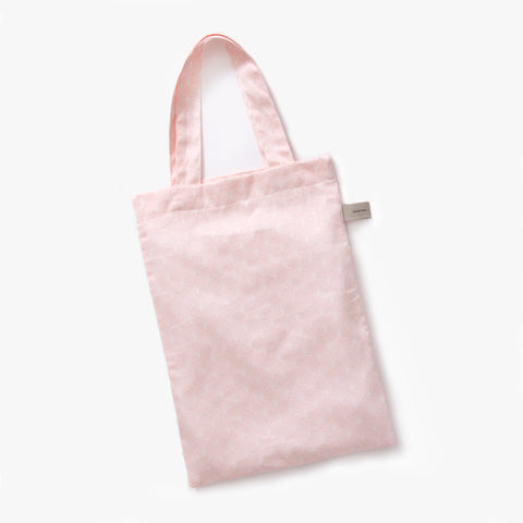 Printed tote bag is included with bedding in "Under The Arches" print in the color pink
