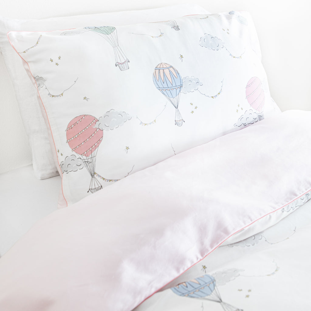 Twin duvet sheet set in the "Touch The Sky" print in the color pink, the set includes a duvet cover and a standard pillowcase