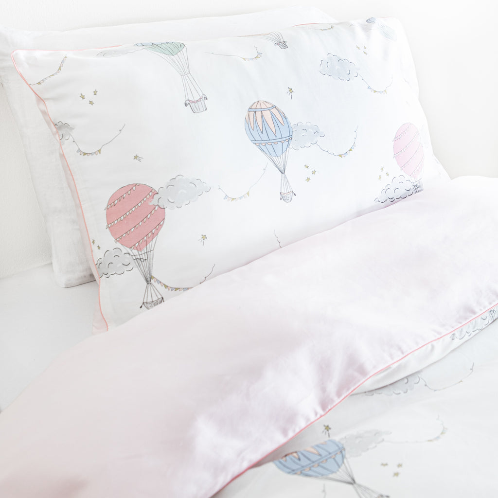 Personalize Me: Twin duvet sheet set in the "Touch The Sky" print in the color pink, the set includes a duvet cover and a standard pillowcase