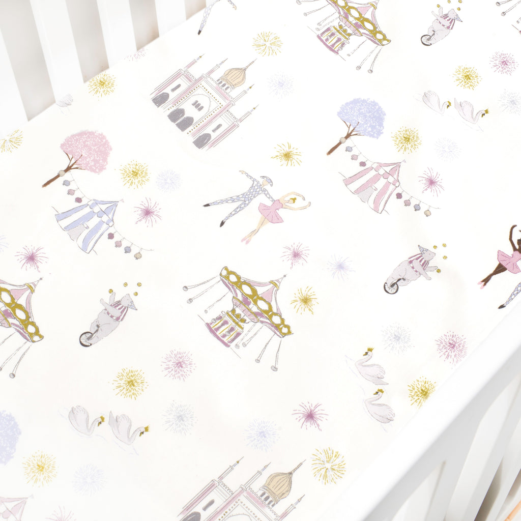 Crib Sheet in "Adventures in Wonderland" print in the color rose featured in a crib