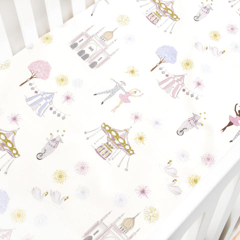 Crib Sheet in "Adventures in Wonderland" print in the color rose featured in a crib