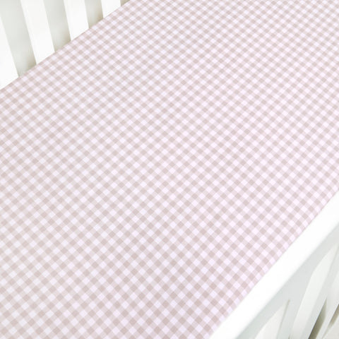 Crib Sheet in Picnic Gingham Print in Beige Color laid on a crib