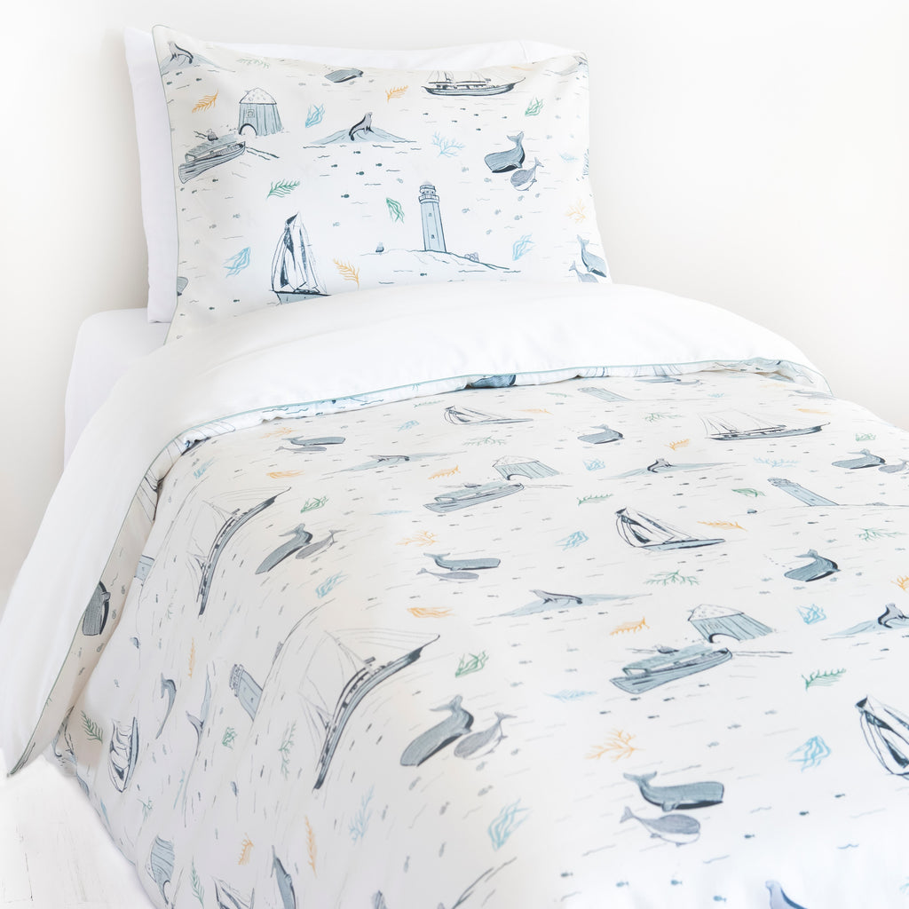 Twin duvet sheet set in the "Never Stop Exploring" print in the color ivory, the set includes a duvet cover and a standard pillowcase