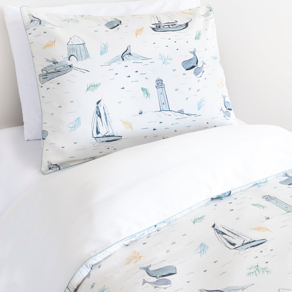 Twin duvet sheet set in the "Never Stop Exploring" print in the color ivory, the set includes a duvet cover and a standard pillowcase