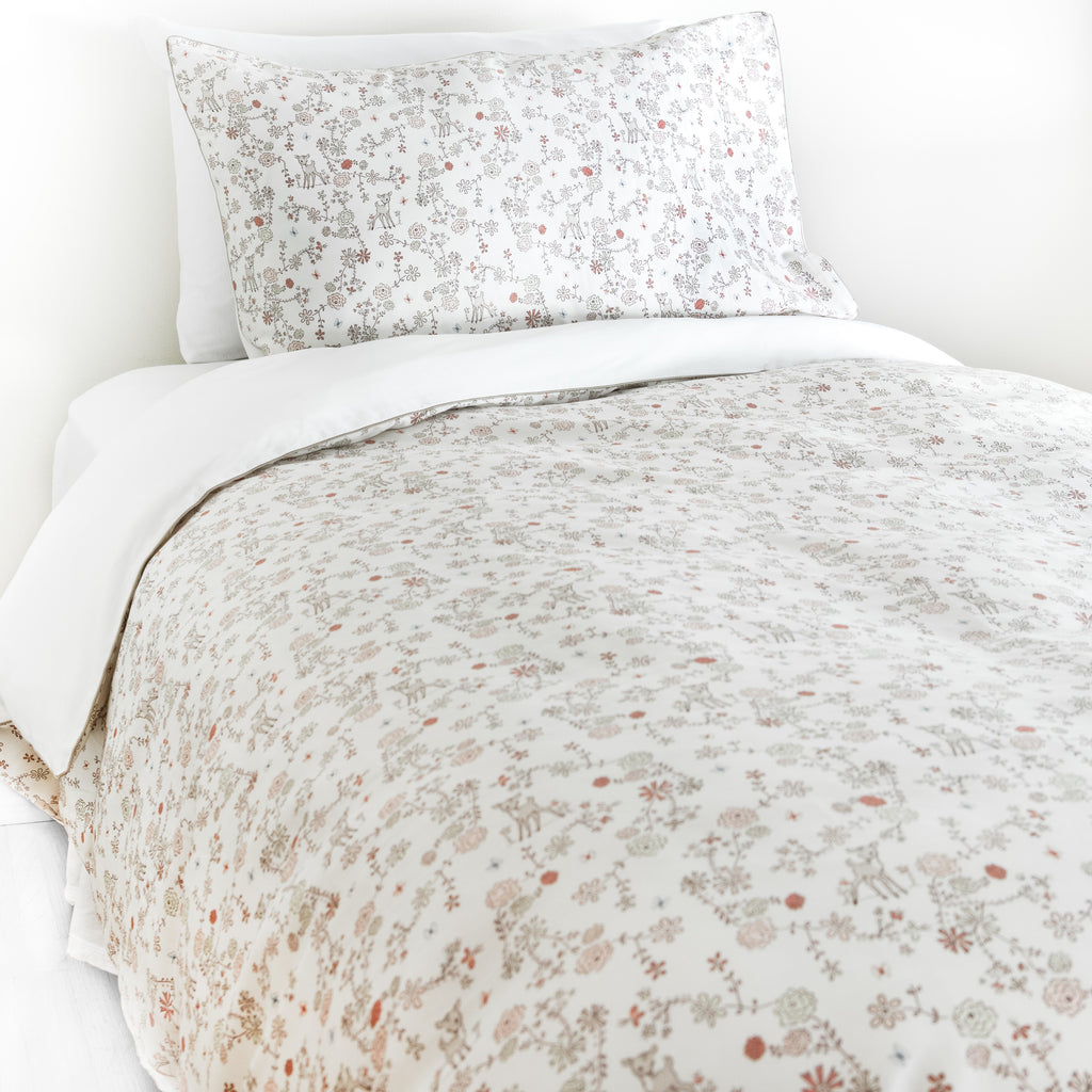 Twin duvet sheet set in the "Into The Woodlands" print in the color ivory, the set includes a duvet cover and a standard pillowcase