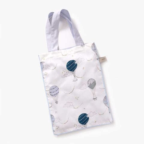 Printed tote bag is included with toddler duvet in "Touch The Sky" print in the color blue
