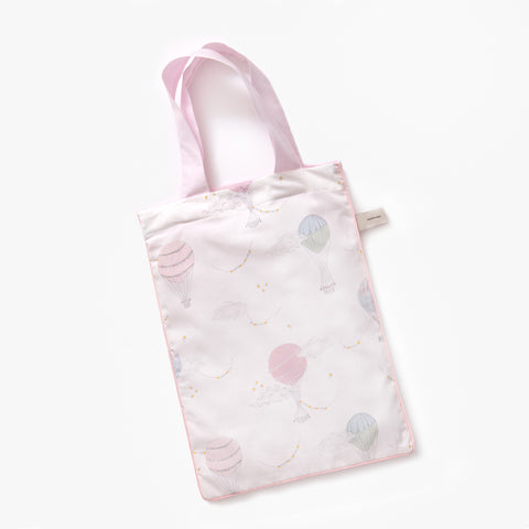 Printed tote bag is included with pillow in Touch The Sky" print in the color pink