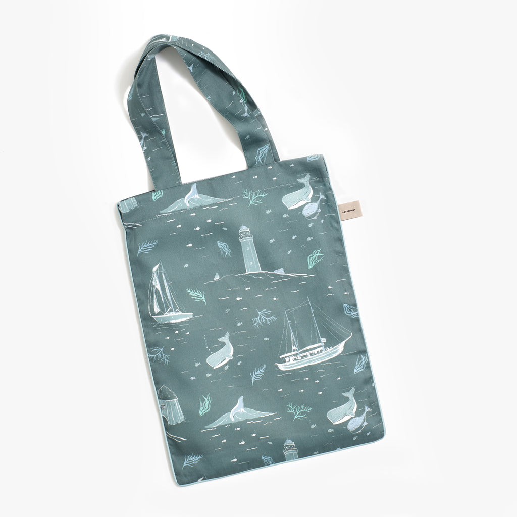 Printed tote bag is included with bedding in "Never Stop Exploring" print in the color sea