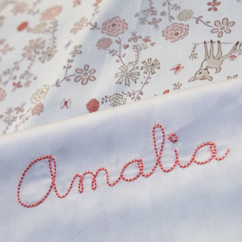 monogram "Amalia" on the  "Into The Woodlands print Baby Duvet in color Ivory